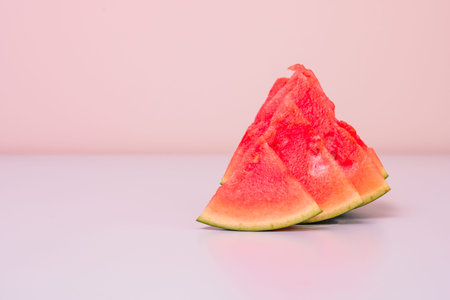 Triangular pieces of seedless watermelonの写真素材