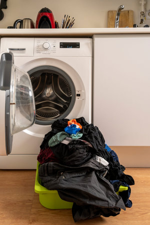 Clothes freshly washed in the washing machine ready to hang and dry in the sun