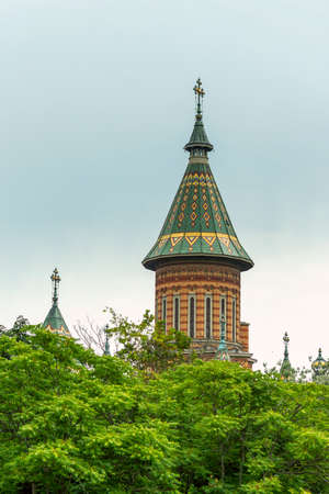 Characteristic towers with green decorated roofs in the center of Timisoara in western Romaniaの写真素材