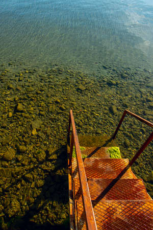 Metal ladder to go down to the sea in a port of the Black Seaの写真素材