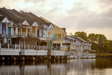 Houses with terraces built on concrete piles on a lake.の写真素材