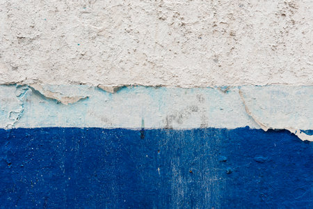 Peeling blue paint texture with various shades of blue. Vector cement and paint textureの写真素材