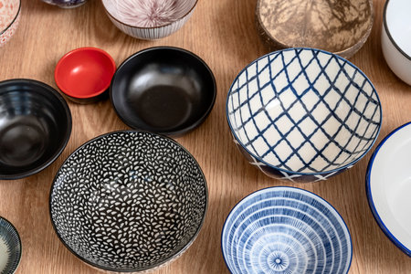 set of bowls of different colors seen from the topの写真素材