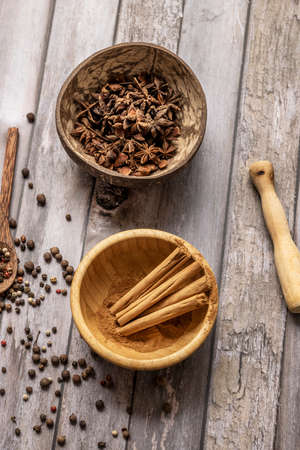 Cinnamon stick, star anise, red and white pepper and juniper berriesの写真素材
