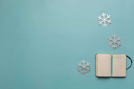 Christmas still life in blue with the year 2022 written on the agendaの写真素材