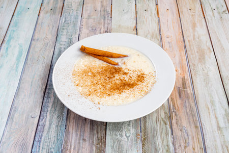 Rice pudding is a typical multi-country dessert that is made by slowly cooking rice pudding and sugar. It is usually sprinkled with cinnamon, vanilla, or lemon peel for flavor.の写真素材