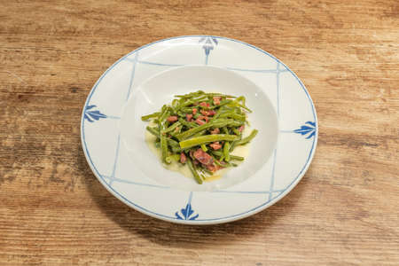Green beans are known by many names: only in Spain, depending on the area, are they called green beans, beans, pods, green caparrones, these with mashed potatoes and serrano ham tacosの写真素材