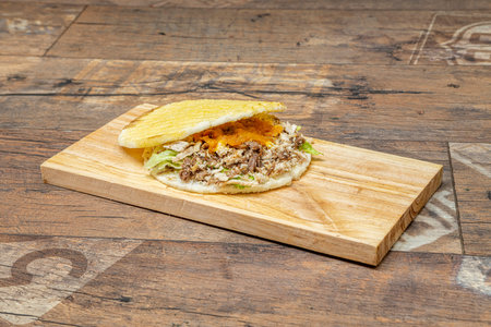 The arepa is a food of pre-Columbian origin, made from ground dry corn dough or precooked corn flour, circular and flattened. It is known under that name in Bolivia, Colombia and Venezuelaの写真素材