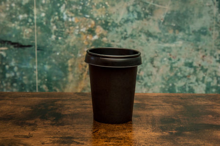 Glass of coffee to go on wooden table