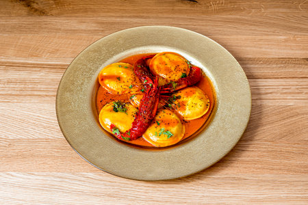 Panciotti with seafood prepared with genuine ingredients of the highest quality, according to typical Italian homemade pasta recipesの写真素材