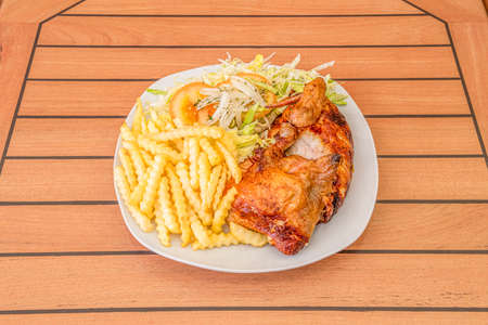 Baked half chicken menu with potatoes is a traditional recipe of our gastronomy that not everyone knows how to prepare so that it is juicy and tastyの写真素材