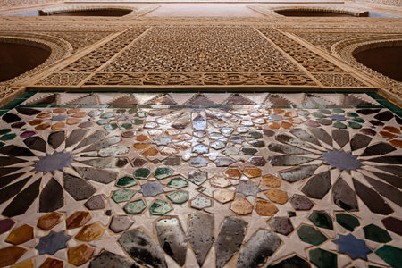 tiles with geometric and arabesque shapes on a wall of some Arab bathrooms