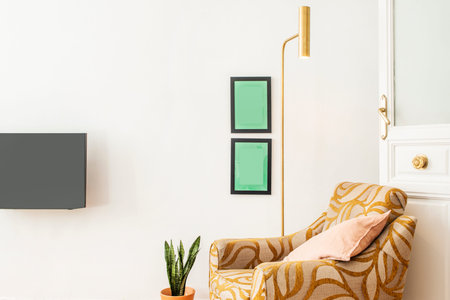 Reading corner with a single sofa, golden lamp, pot with sansevieria and wooden door with glass
