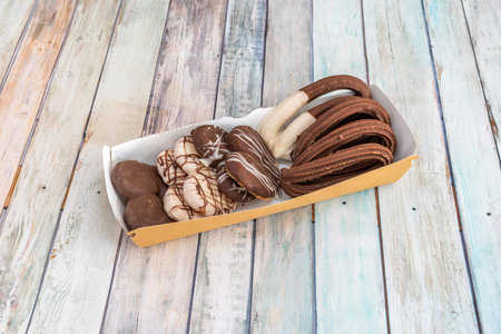 Assortment of palm trees and chocolate covered churros of different flavors