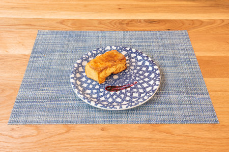 Torrija is a slice of bread that is soaked in milk, syrup or wine and, after coating it with egg, it...