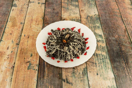 Achieving the sweet texture and all the flavor of the squid is key to this sweet black rice that will take us back to the best memories of flavors from the seaの写真素材