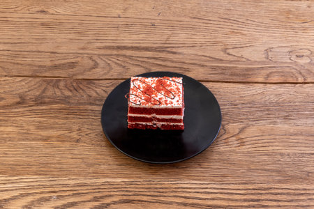 A red velvet cake is a chocolate cake with a deep red or bright red color. Usually prepared as a layered cake topped with a cooked roux or cream cheese frostingの写真素材
