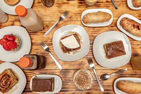 Set of Venezuelan sweet dishes with golfeados, tartlets with hand cheese, stuffed cachitos and...