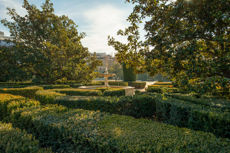 Hedges and marble fountains in gardens attached to the royal palace in Madrid