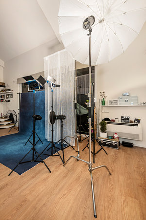 Photography studio with diffusers, backgrounds, spotlights and other paraphernaliaの写真素材