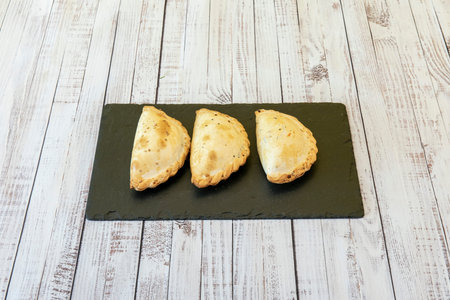 the empanadas are very similar to those from Tucuman, although somewhat larger. The most common fillings are beef, chicken, humita, vegetables, and ham and cheeseの写真素材