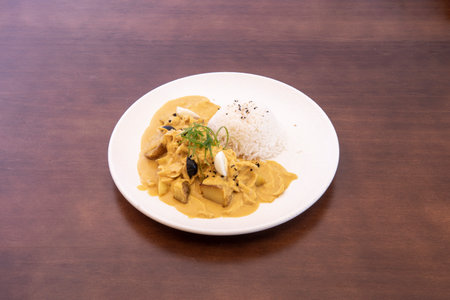 AjÃ­ de gallina is a typical dish of Peruvian cuisine, specifically from the coast that consists of a chili or thick cream with shredded chicken breast. This cream is served with boiled potatoesの写真素材
