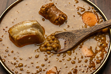 Lentils with chorizo are a traditional stewed culinary preparation from the province of Ãvila. The popularity of the dish was strengthened throughout all of Spanish cuisine with various meat variantsの写真素材