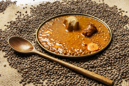 Lentils with chorizo are a traditional stewed culinary preparation from the province of Ãvila. The popularity of the dish was strengthened throughout all of Spanish cuisine with various meat variantsの写真素材