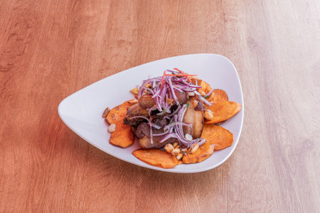 ChicharrÃ³n is a food that in some countries is obtained after melting pork fat, in others the pork fat is used to cook the meat and in others it consists of frying the pig's skinの写真素材