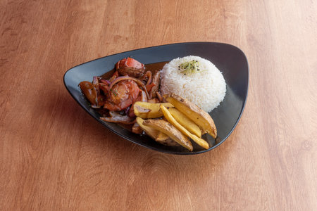 The salted loin is a typical dish of Peruvian gastronomy consisting of beef, cooked rice and French fries. It is one of the most popularly consumed dishes in Peruの写真素材