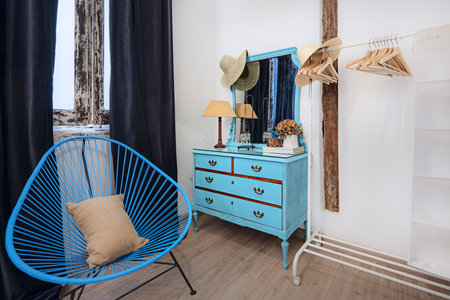 Room of a loft-style house with open kitchen and armored access doorの写真素材