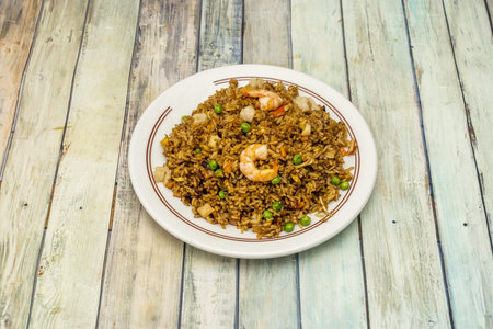 Fried rice with vegetables, prawns and soy sauce, it is very simple to prepareの写真素材