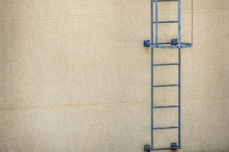 blue metal service ladder on a roof top rooftopの写真素材