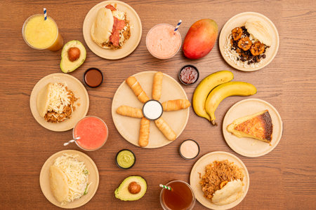 set of venezuelan fast food dishes with many assorted arepas on a wooden tableの写真素材