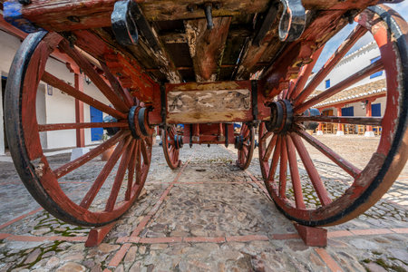 A vintage wooden cart for working in the fields painted red