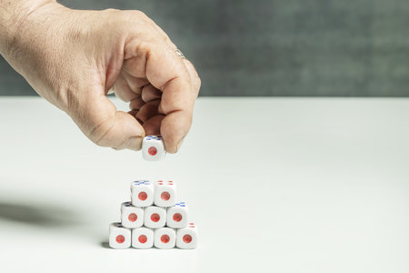 A die is an object prepared to show a random result when thrown on a horizontal surface, from the hand or from a cupの写真素材