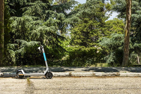 Typical current urban image with a solitary electric skate in the middle of the streetの写真素材