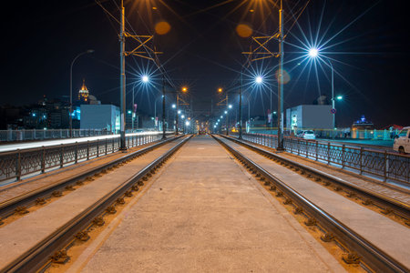 Night image of tram rails over the Galata Bridge in Istanbul, Turkeyの写真素材