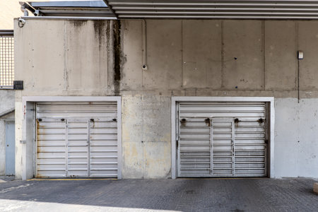 Metal lift access doors to individual garagesの写真素材
