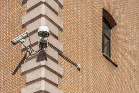 Surveillance cameras attached to a cornerの写真素材
