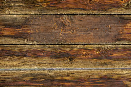 Stripped wood boards in brown tones.の写真素材