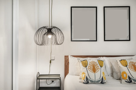 Detail of the decoration of the headboard of the bed in a bedroom with a double bed with cushions...