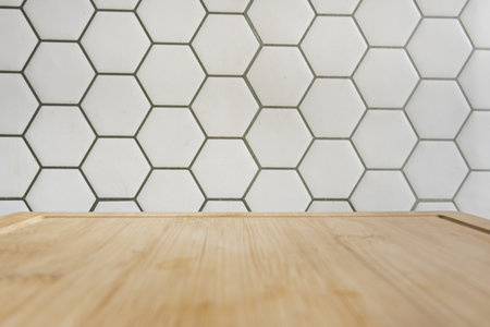A wall of hexagon design tiles and wooden boardの写真素材
