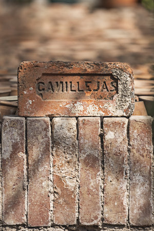 Terracotta bricks with a legend of a neighborhood in Madridの写真素材