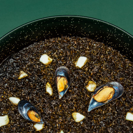 Black paella: Squid ink and black rice, a visually and tastefully striking dishの写真素材