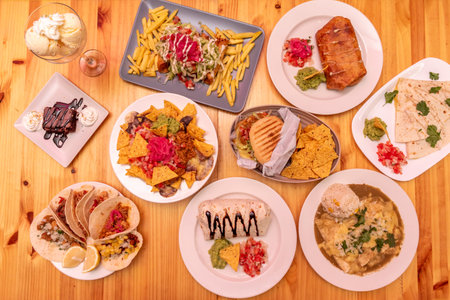 Nachos and guacamole are two of the most iconic dishes in Mexican cuisine, recognized and appreciated throughout the world.の写真素材