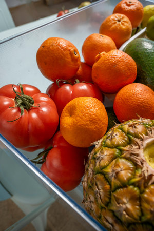 An image of fresh seasonal fruits ready to eat inside a plastic basket.
