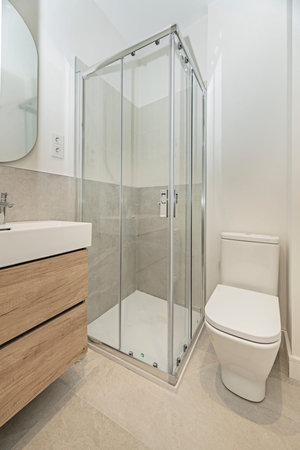 Cherry wood wall-mounted vanity unit with spacious drawers, designed to maximize storage in...