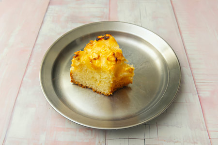 Fluffy vanilla sponge cake with an intense natural aroma, decorated with fine white chocolate shaves...