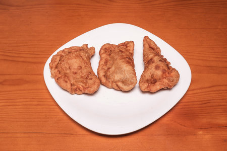 Beef and vegetable empanadas, homemade pastry, served with homemade tomato sauce